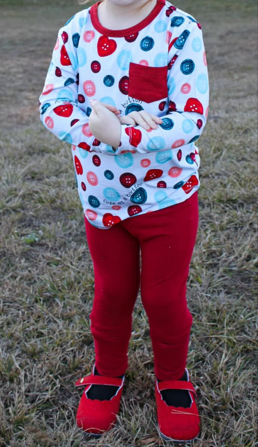 Cute as a button long sleeve pocket tee